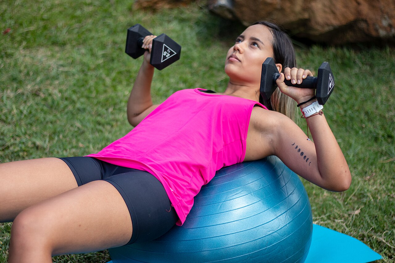 Dumbbell chest press on a stability ball